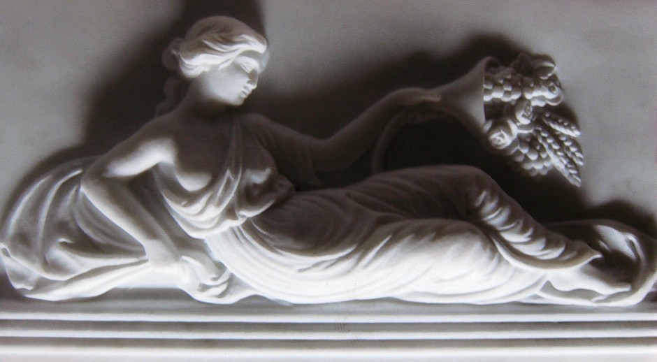 A reverse lit photo to show detail - marble carving reclining lady