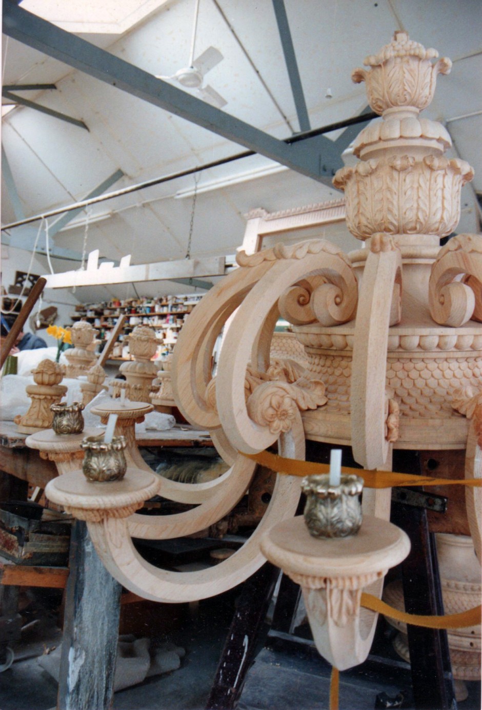 Candelbra in the procress of being fitted - candelabra chandlier kensington palace wood carving 