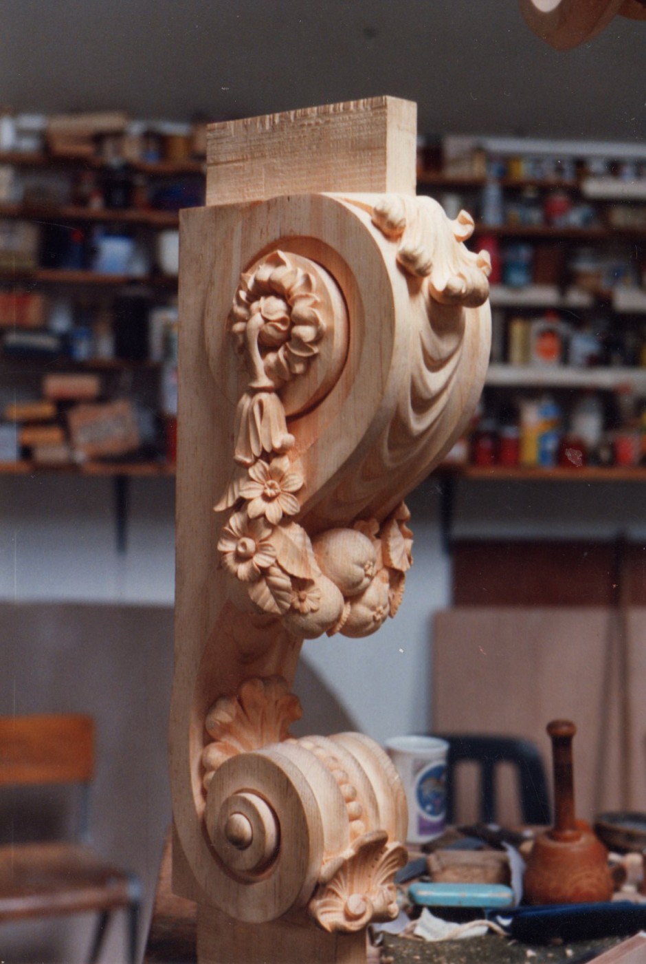 Close up detail of carving showing swags, shells - swags shells console table hampton court