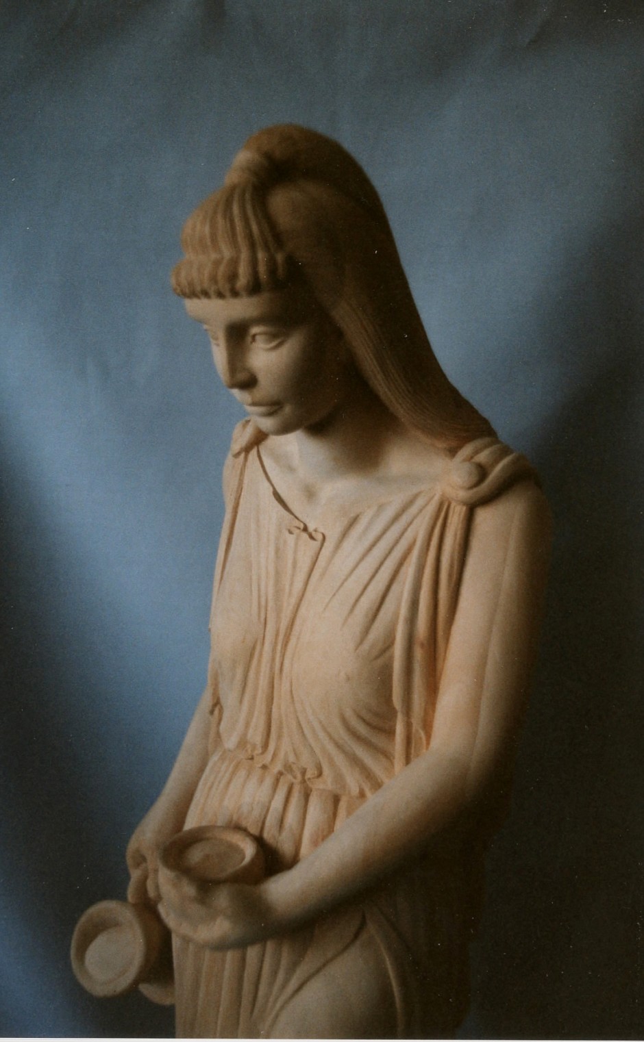 Close up of the carving - water giver maid maiden water distributor