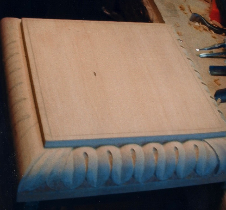 Detail carving on the base begins - base carving, detail carving, wood, pineapple, plinth