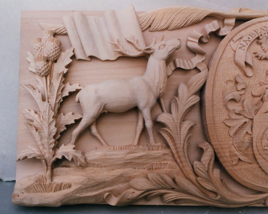 Enlarged view of the left hand side to show detail - deer plaque wood carving
