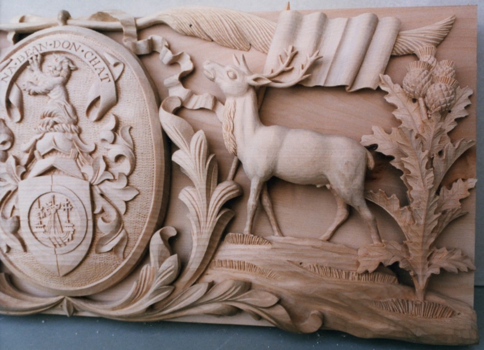 Enlarged view of the right hand side showing carving details - wood carving thistle deer ribbon