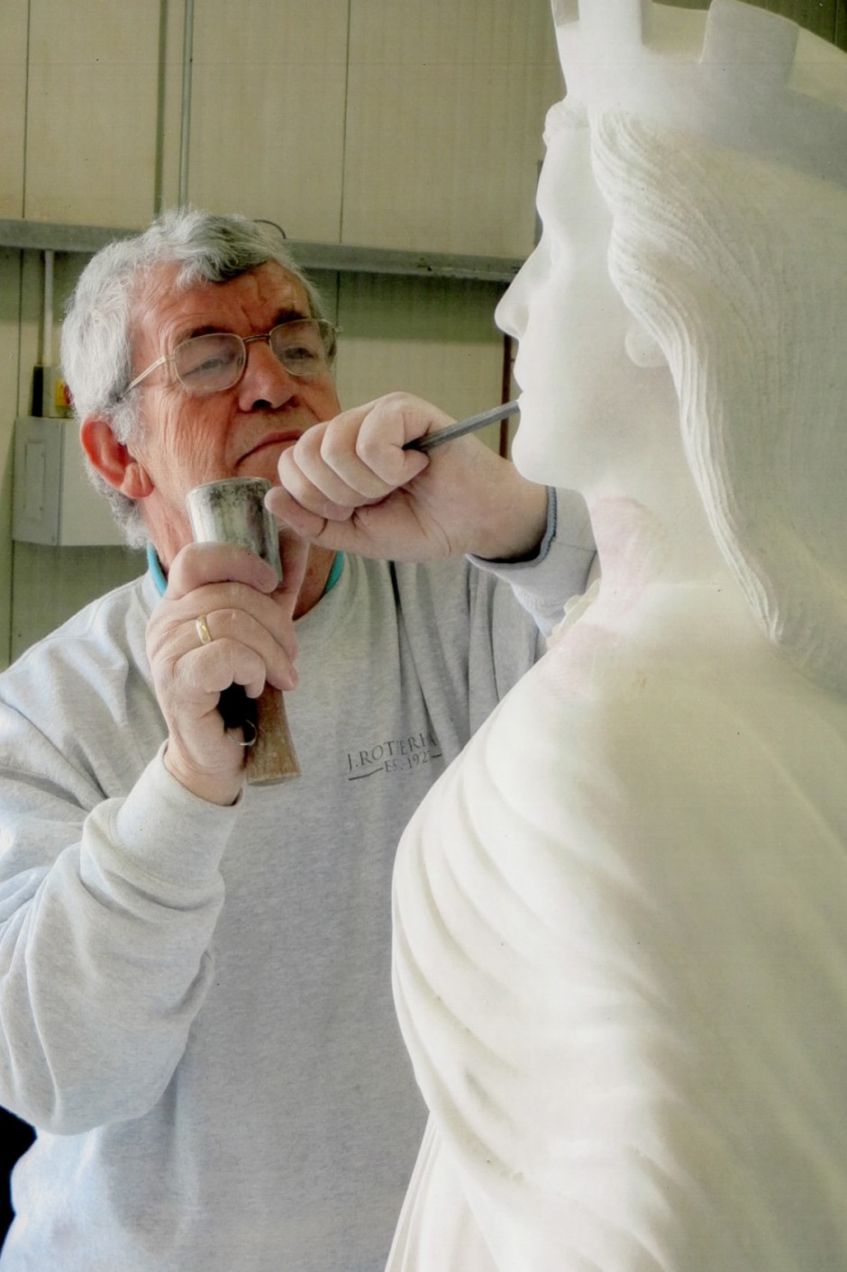 Jose Sarabia at work on the War Memorial Statue - horndean war memorial