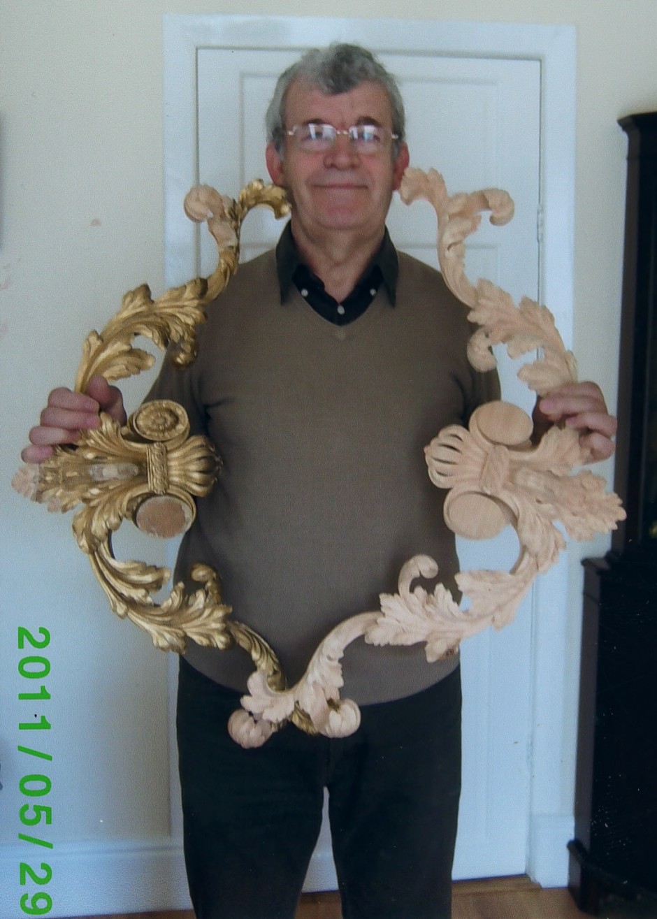Jose with 2 restored segments of the Chippendale Mirror Frame - chippendale mirror jose sarabia