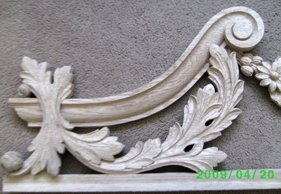 Left hand edge of the traditionally carved door frame top - traditional wood carving