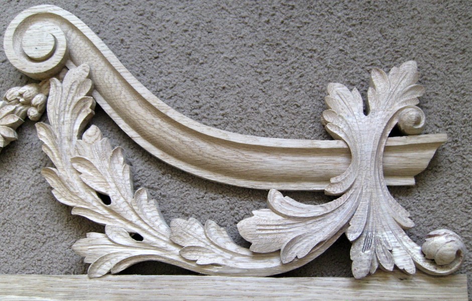 Right hand edge of the traditionally carved door frame top - wooden door frame top