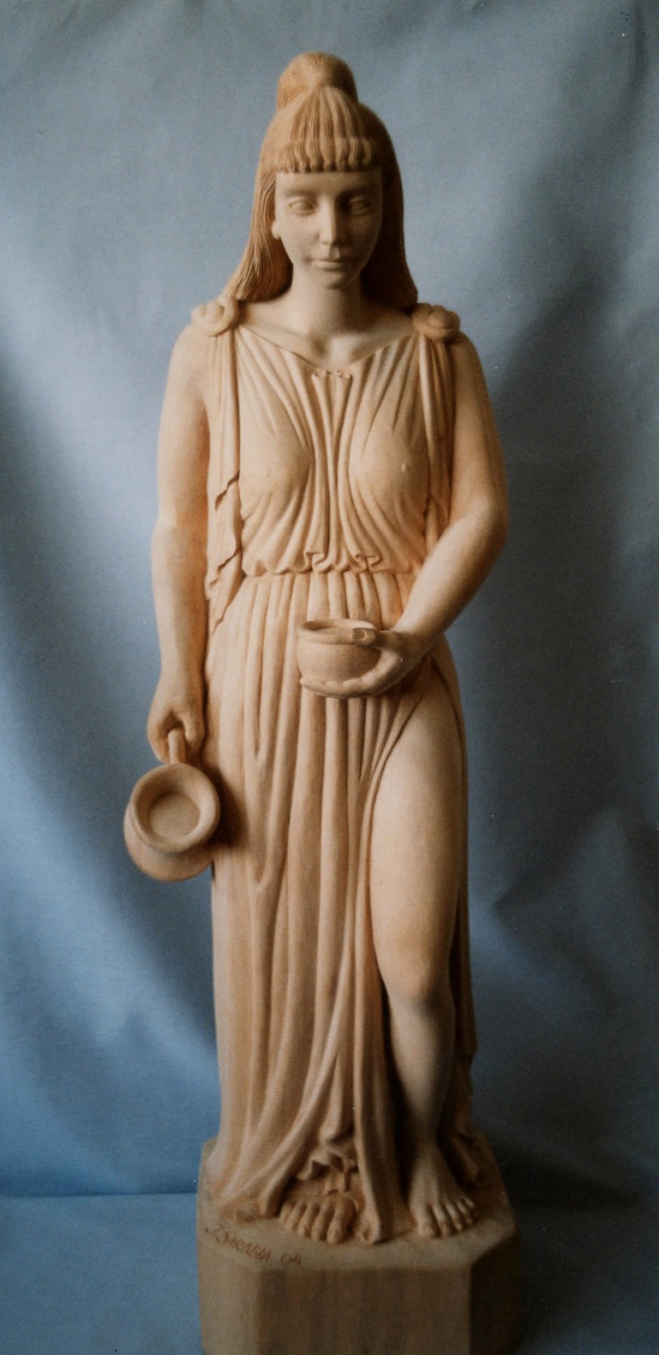 Water Maid Distributing Water. - water maid, water giver, ornament, gnome, carving